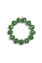 Elastieke kralenarmband met grote kralen - leger groen