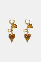 Oorbellen met hangende harten aan ketting